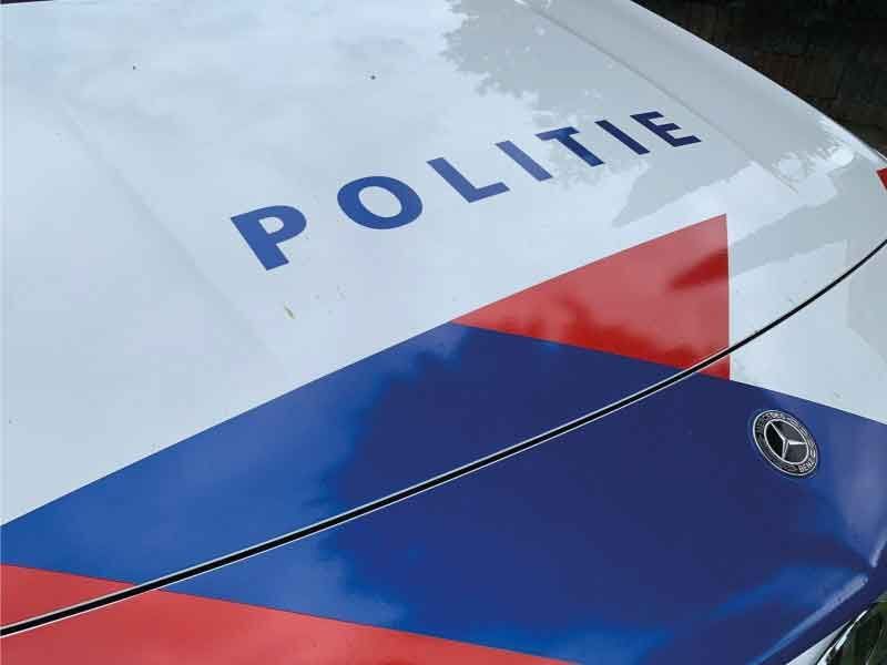 Logo van de Politie op de auto